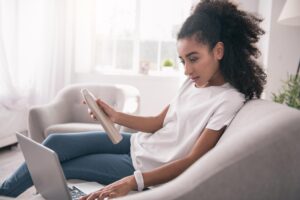 A customer reads product reviews before making an online purchase, illustrating how social proof builds trust.